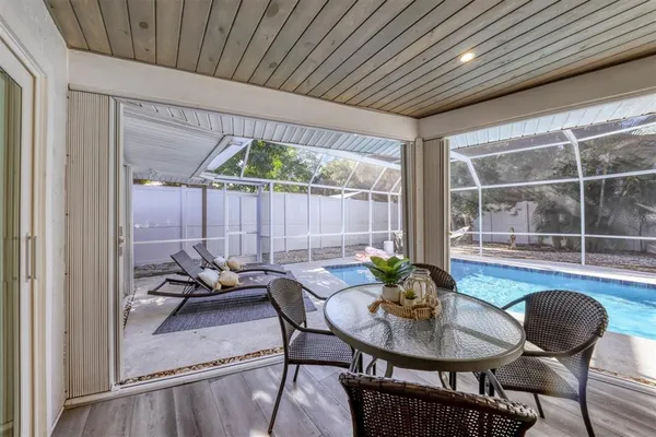 a view of a swimming pool with a patio