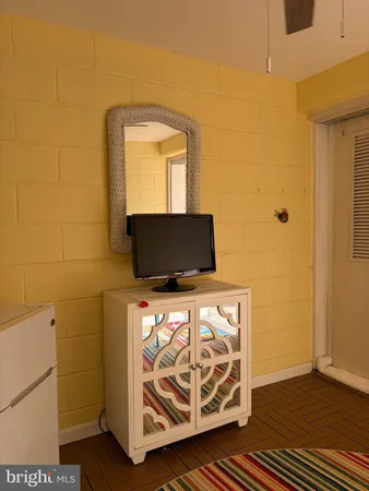 a bathroom with a sink toilet and mirror