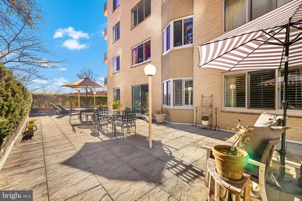 a view of a building with outdoor seating