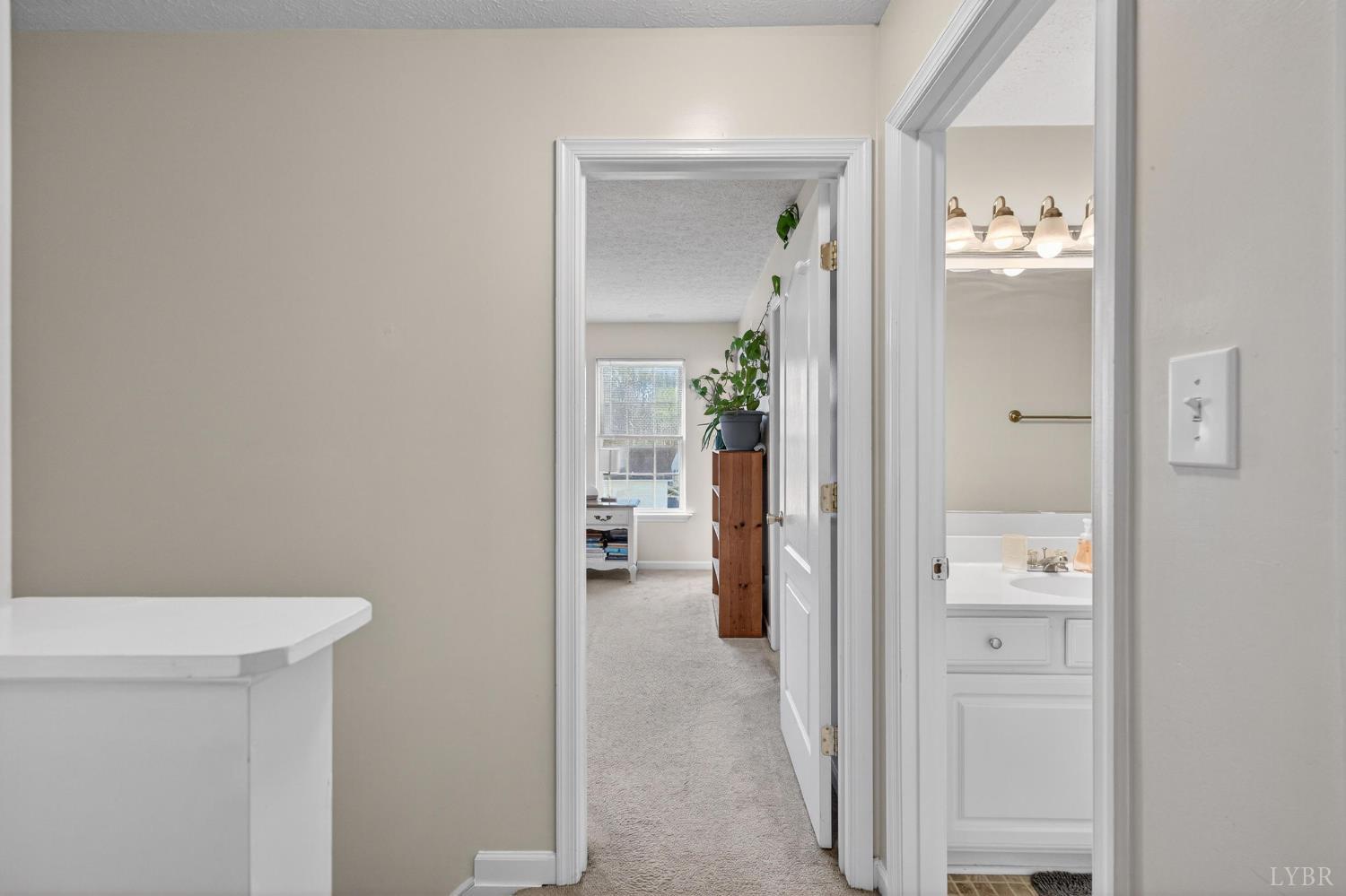 211 Wessex Road Lynchburg, VA 24501 - Photo 21 of 56 a view of a hallway with wooden floor and a bathroom