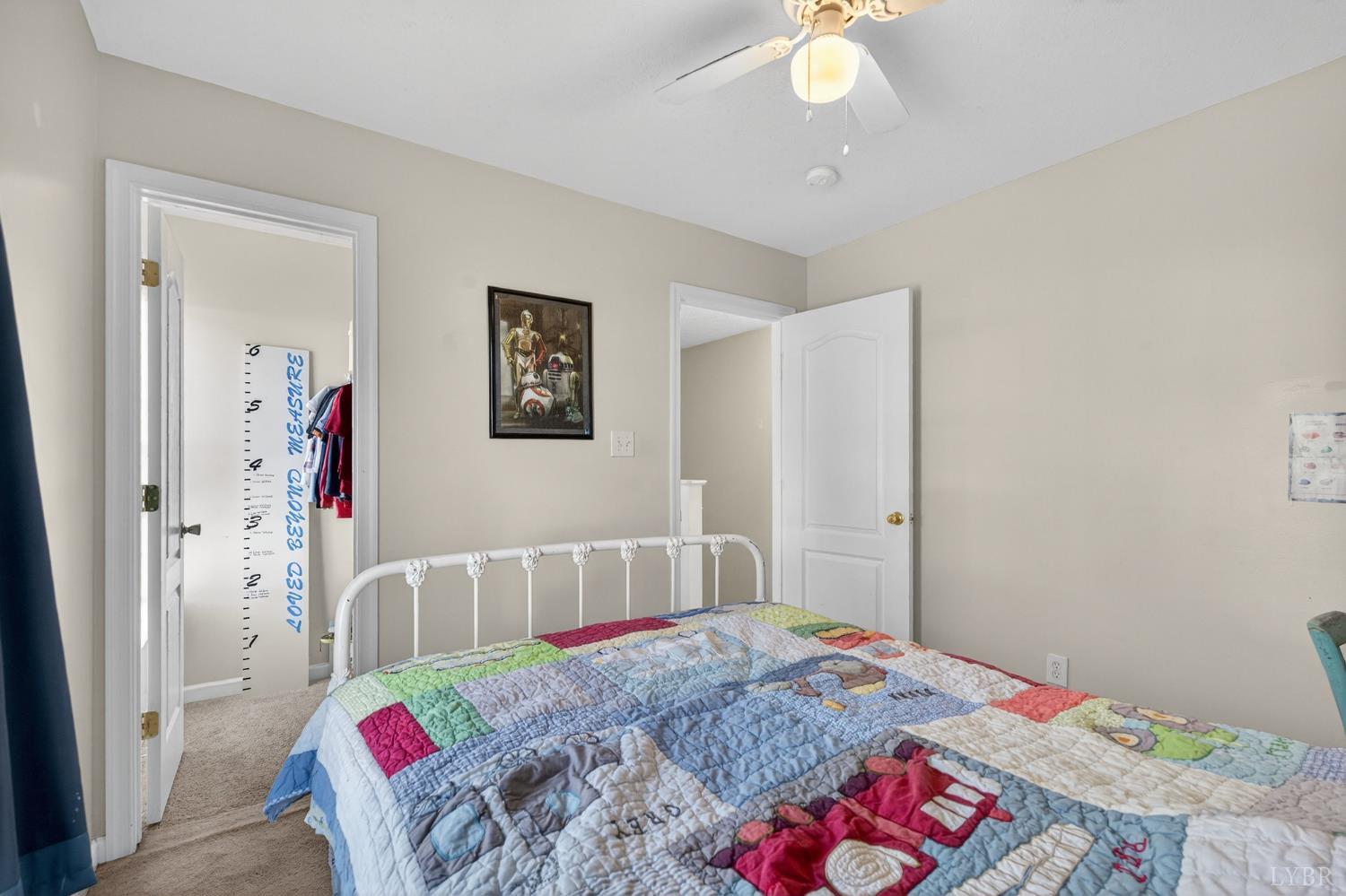 211 Wessex Road Lynchburg, VA 24501 - Photo 25 of 56 a bedroom with a bed and a chandelier