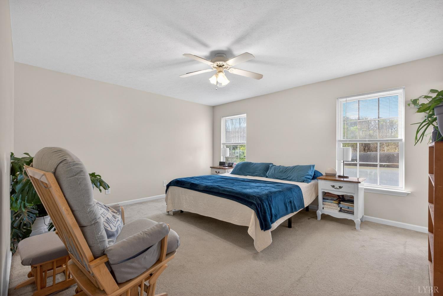 211 Wessex Road Lynchburg, VA 24501 - Photo 28 of 56 a bedroom with a bed and a chandelier
