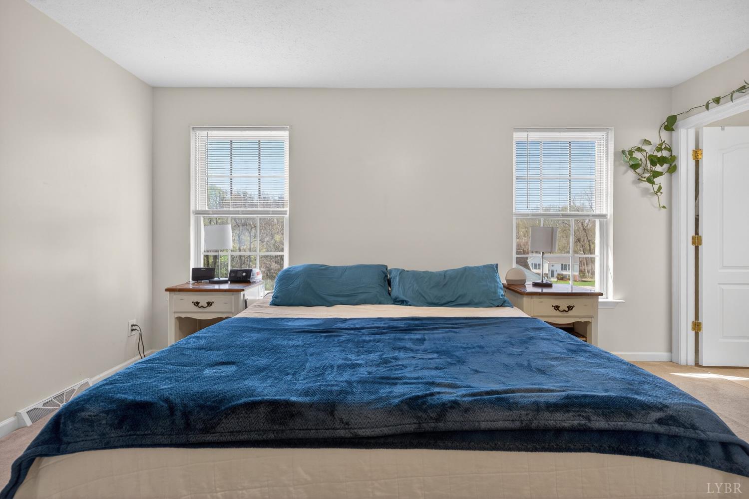 211 Wessex Road Lynchburg, VA 24501 - Photo 29 of 56 a bedroom with a large bed and wooden floor