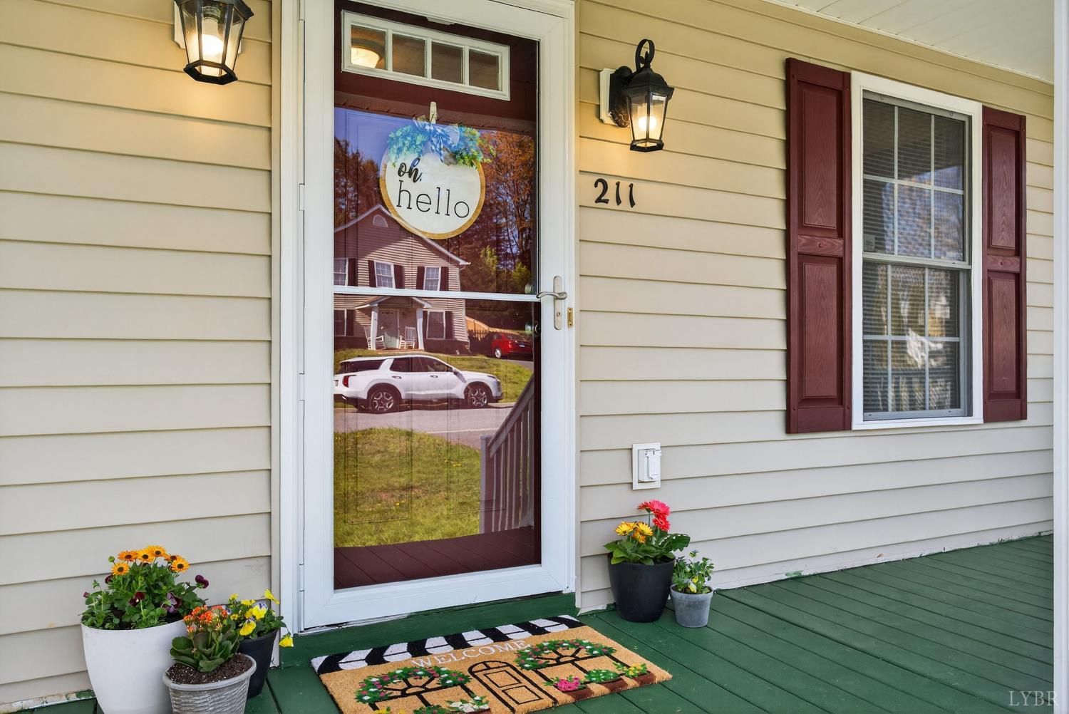 211 Wessex Road Lynchburg, VA 24501 - Photo 44 of 56 a view of a door of a house with potted plants