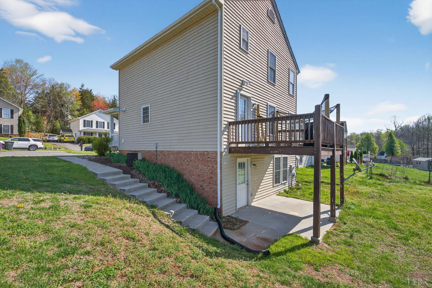 211 Wessex Road Lynchburg, VA 24501 - Photo 47 of 56 a view of a house with a yard and a patio