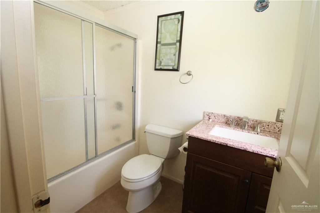 110 Avenida Morelos Rancho Viejo, TX 78575 - Photo 11 of 19 a bathroom with a sink a toilet and shower