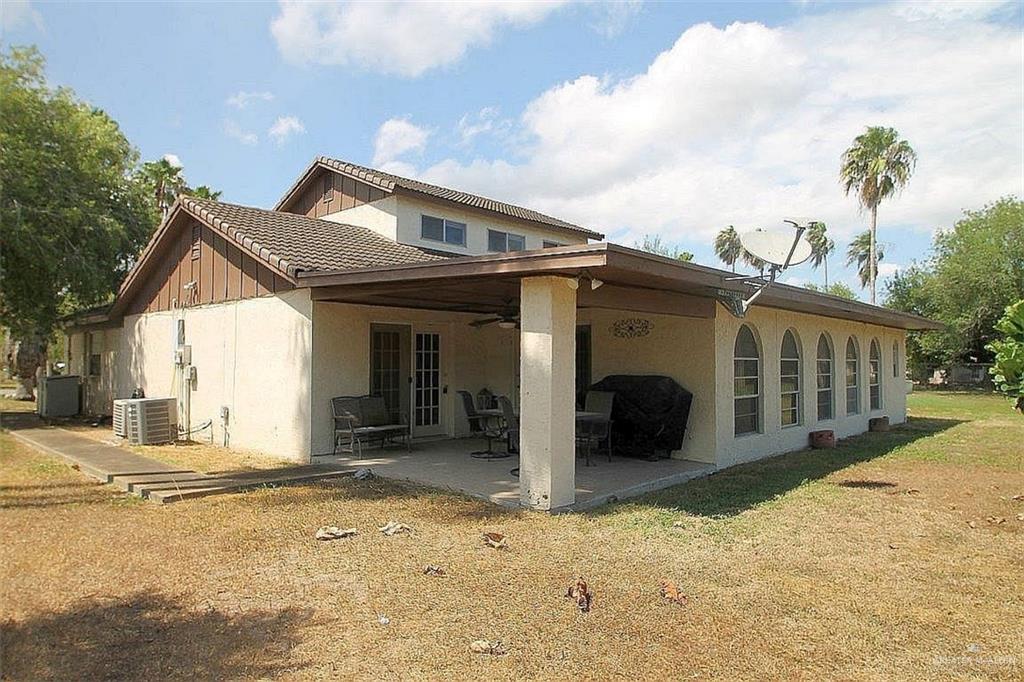 110 Avenida Morelos Rancho Viejo, TX 78575 - Photo 18 of 19 a view of a house with a yard covered in snow