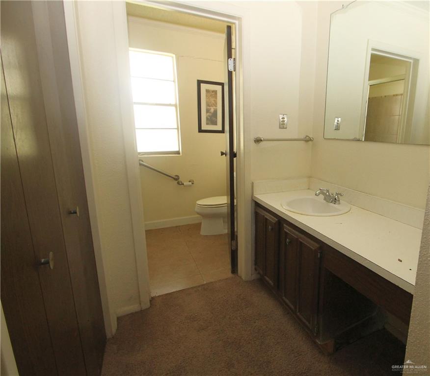 110 Avenida Morelos Rancho Viejo, TX 78575 - Photo 7 of 19 a bathroom with a sink a toilet and shower