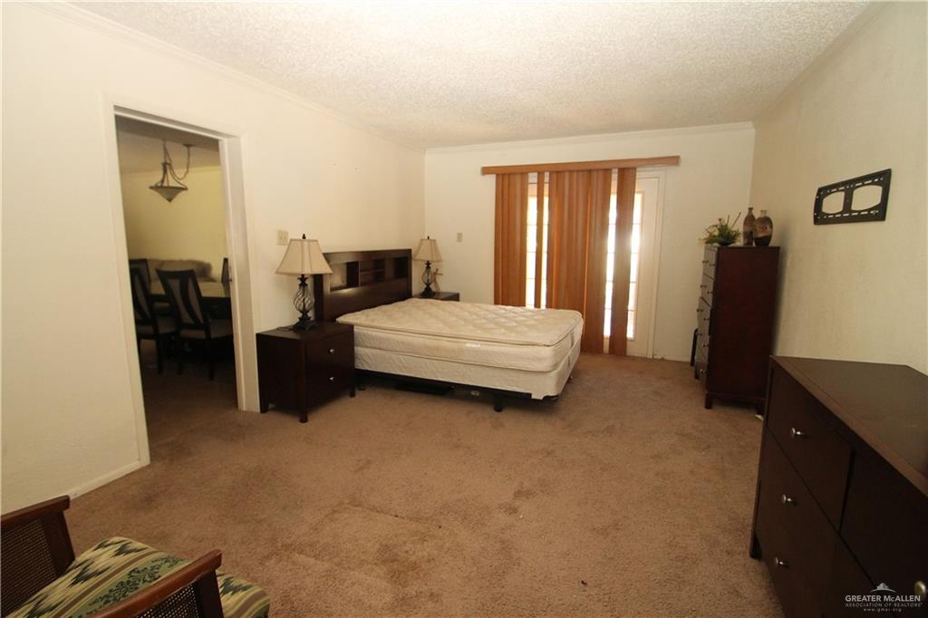 110 Avenida Morelos Rancho Viejo, TX 78575 - Photo 8 of 19 a bedroom with bed and window