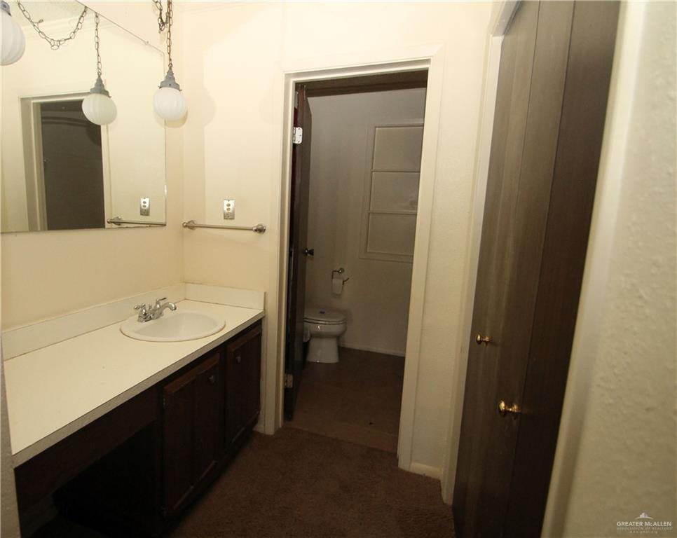 110 Avenida Morelos Rancho Viejo, TX 78575 - Photo 9 of 19 a bathroom with a double vanity sink and a mirror