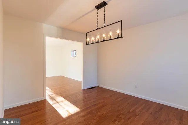a view of a livingroom with wooden floor