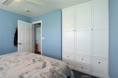 a view of a backyard with wooden fence