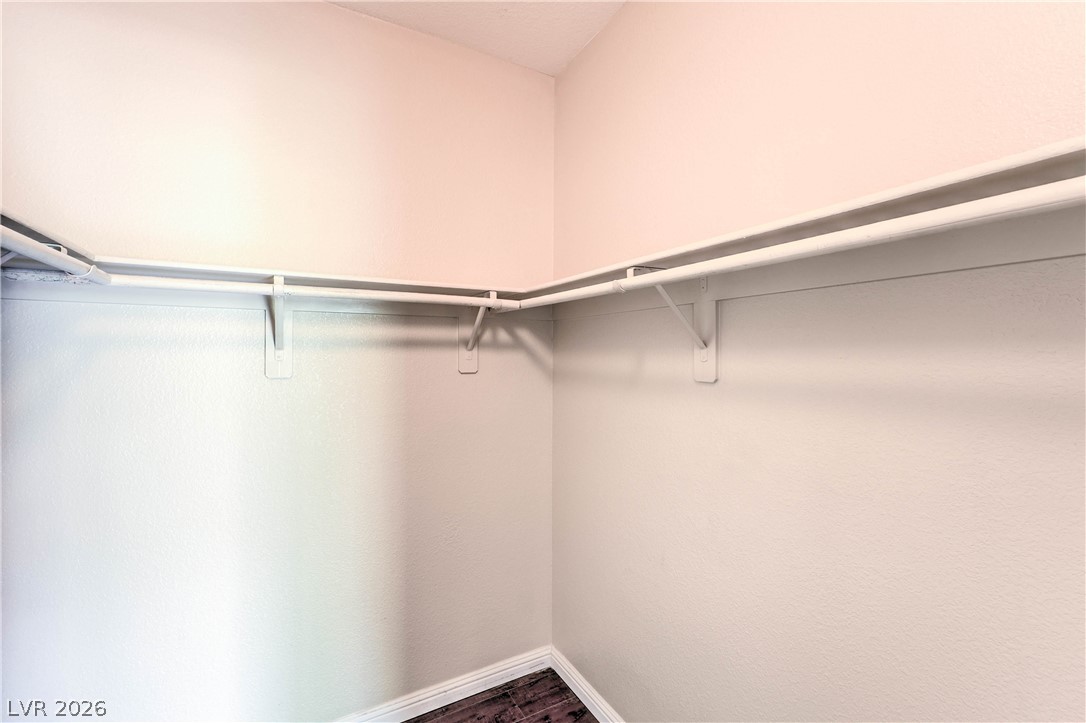 9050 West Warm Springs Road, Unit 2033 Las Vegas, NV 89148 - Photo 21 of 30 Functional closet space offers efficient storage with dual-level hanging rods.