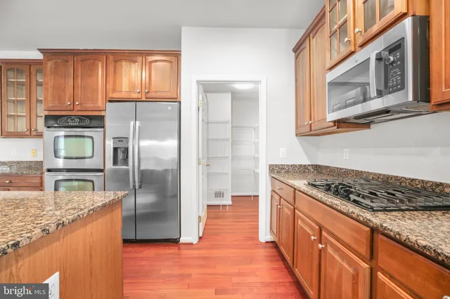an empty room with furniture and a fireplace