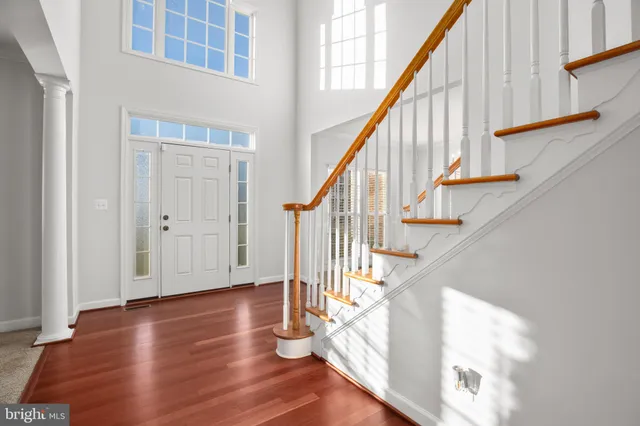 a view of entryway with wooden floor