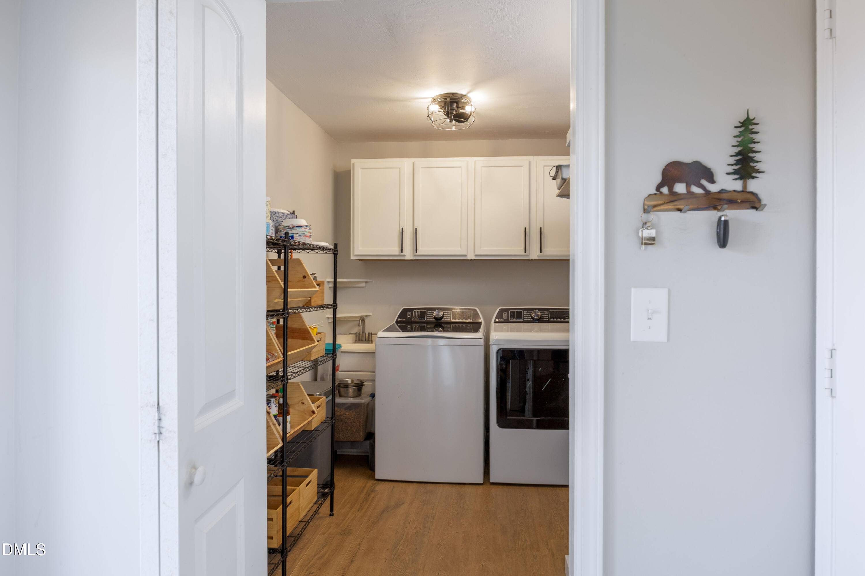 760 Eugene Jernigan Road Dunn, NC 28334 - Photo 11 of 30 a view of a kitchen with a white cabinet and a stove top oven