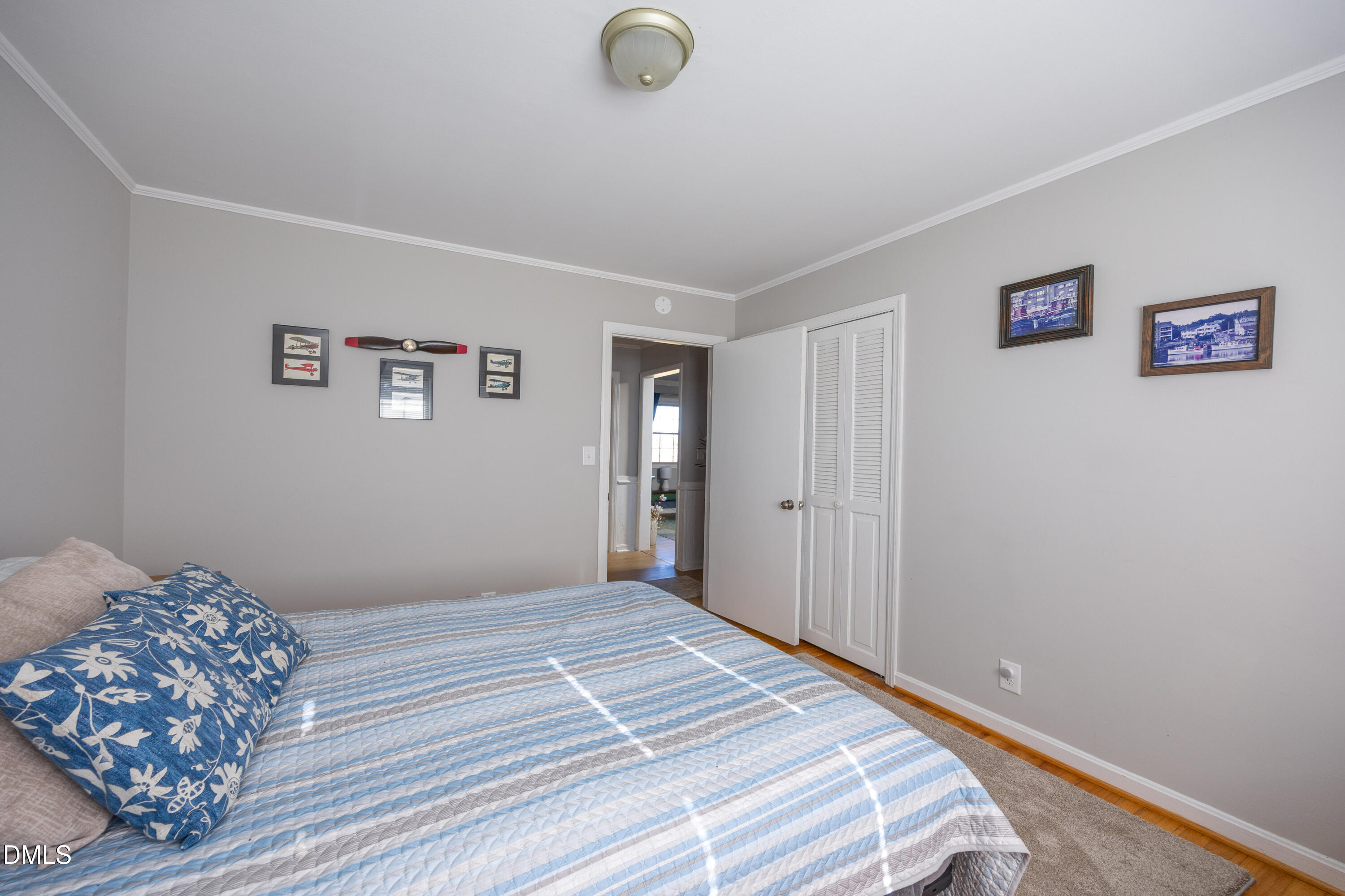 760 Eugene Jernigan Road Dunn, NC 28334 - Photo 18 of 30 a bedroom with bed and painting on the wall