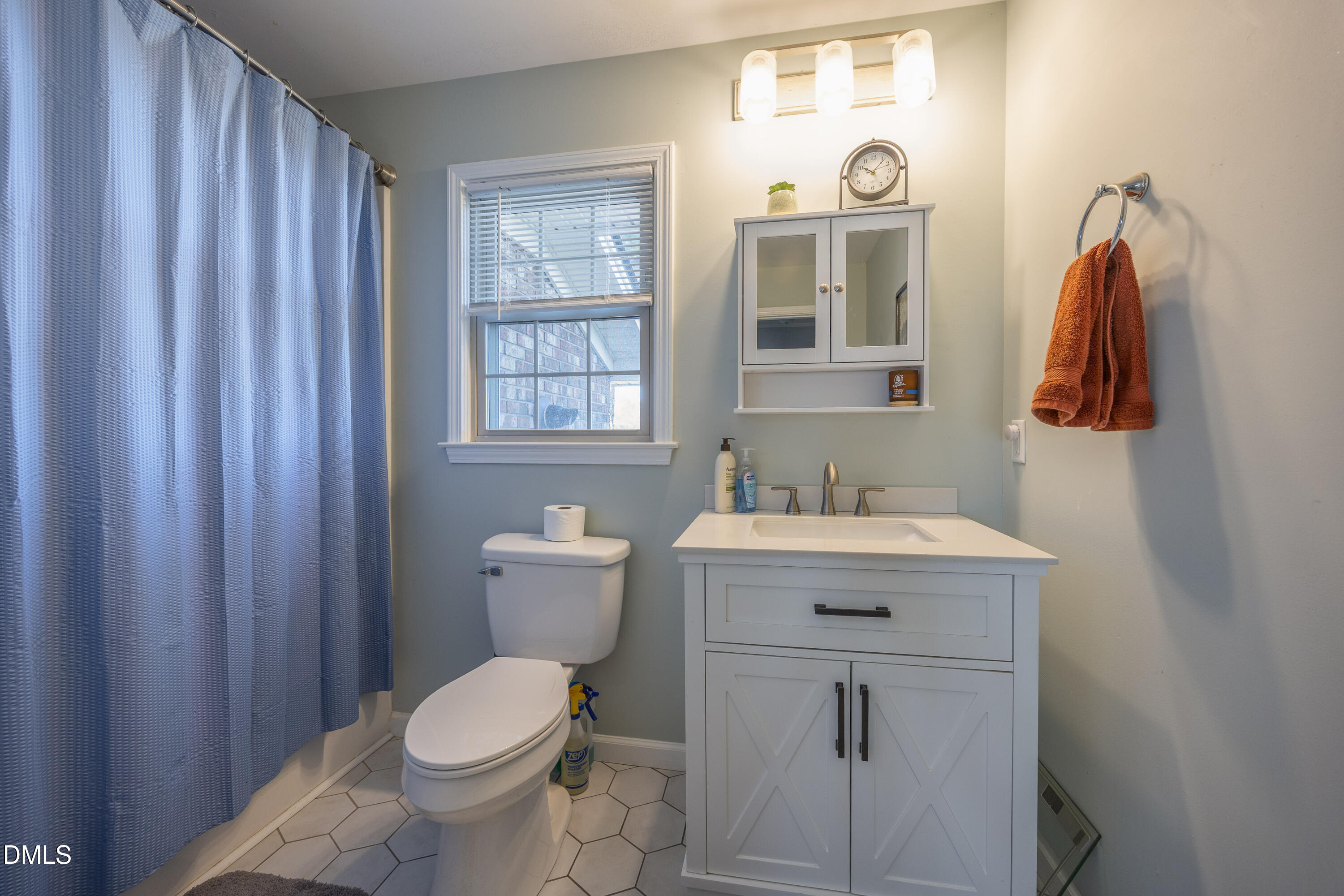 760 Eugene Jernigan Road Dunn, NC 28334 - Photo 19 of 30 a bathroom with a sink a toilet and shower