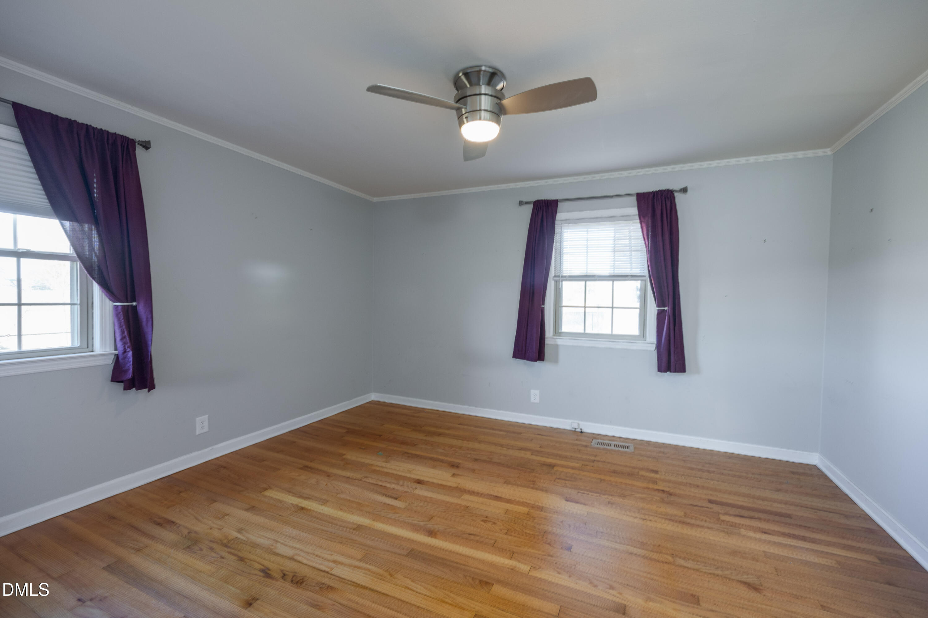 760 Eugene Jernigan Road Dunn, NC 28334 - Photo 22 of 30 a view of an empty room with wooden floor and a window