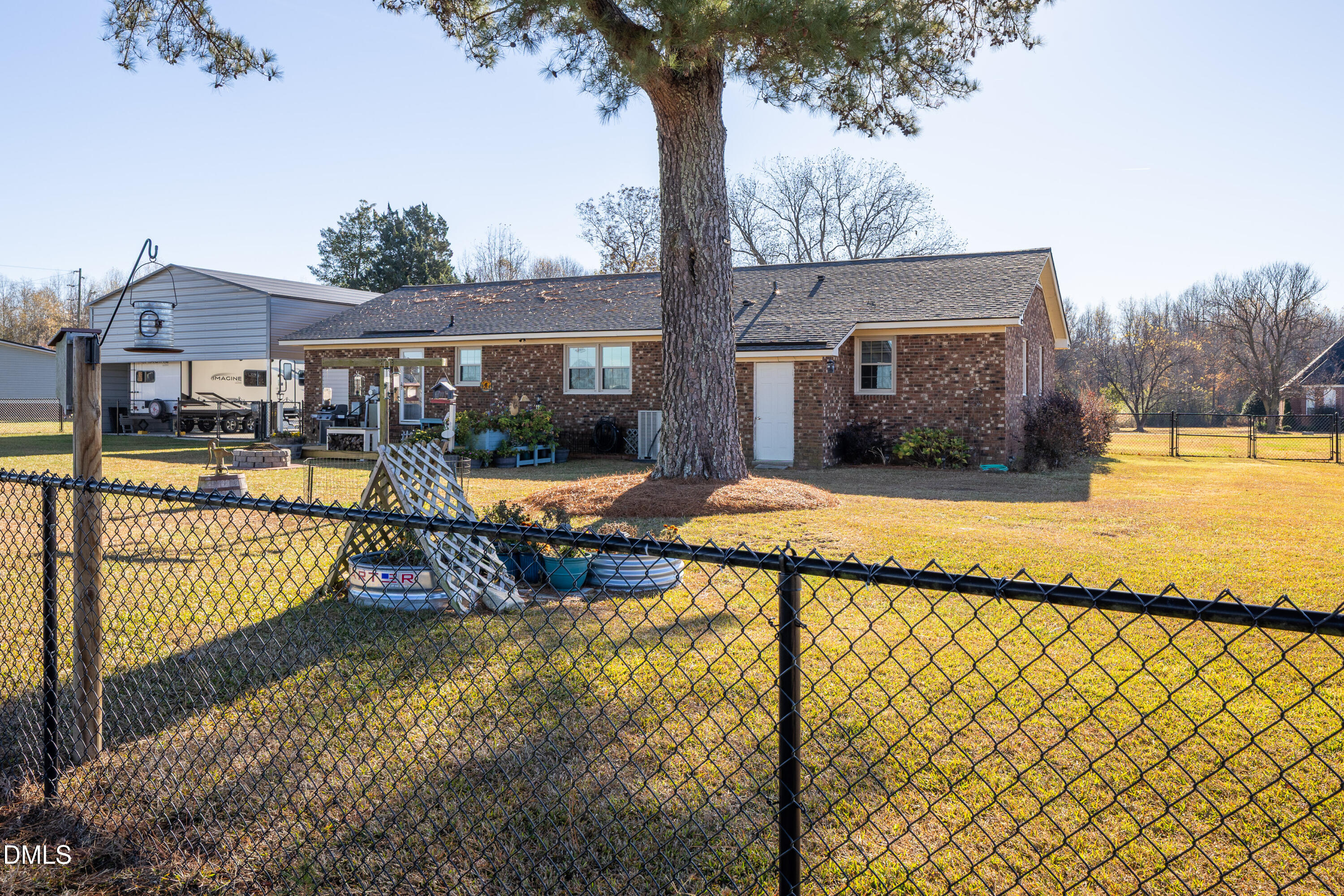 760 Eugene Jernigan Road Dunn, NC 28334 - Photo 27 of 30 a view of a house with backyard and sitting area