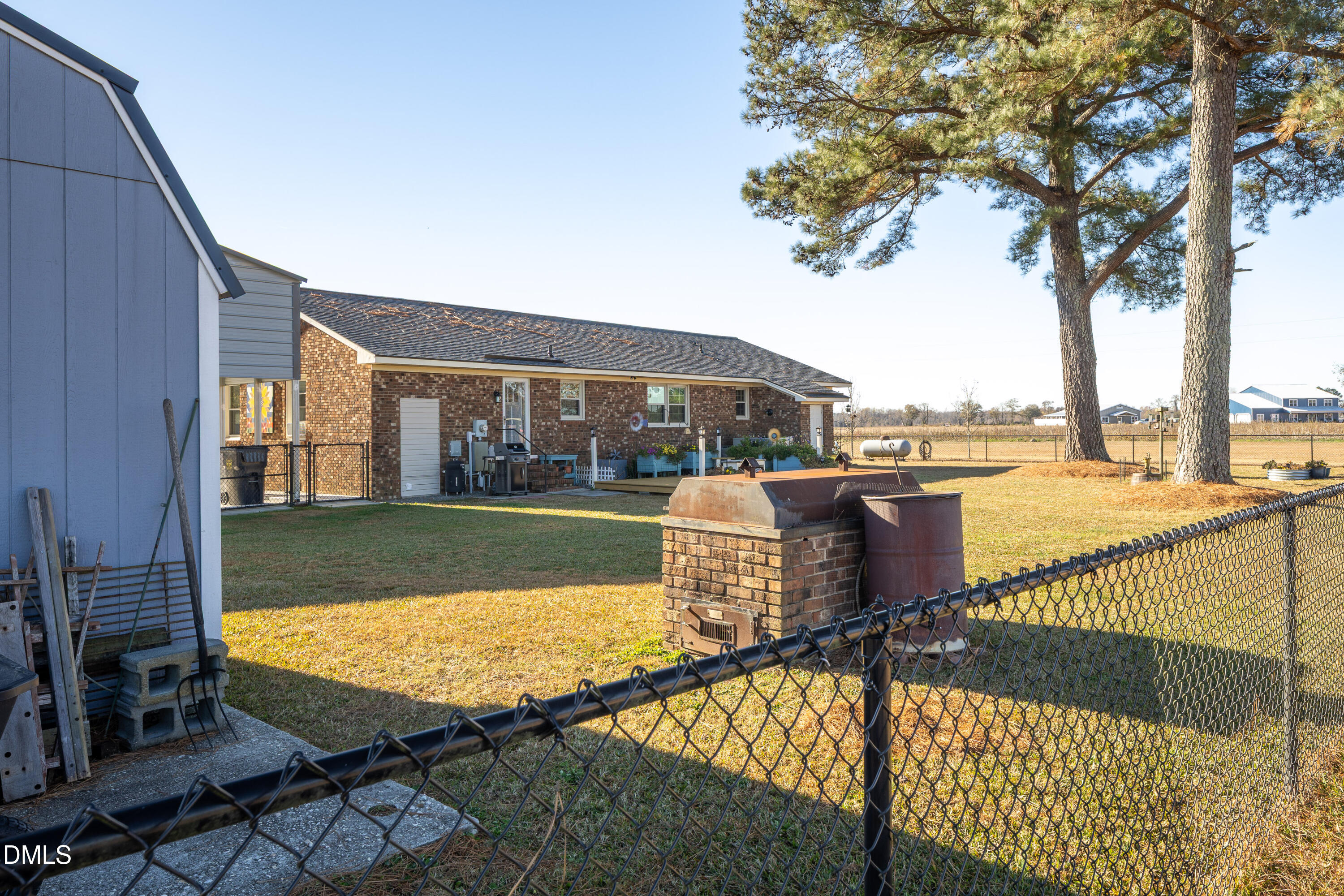 760 Eugene Jernigan Road Dunn, NC 28334 - Photo 28 of 30 a view of a house with swimming pool and sitting area