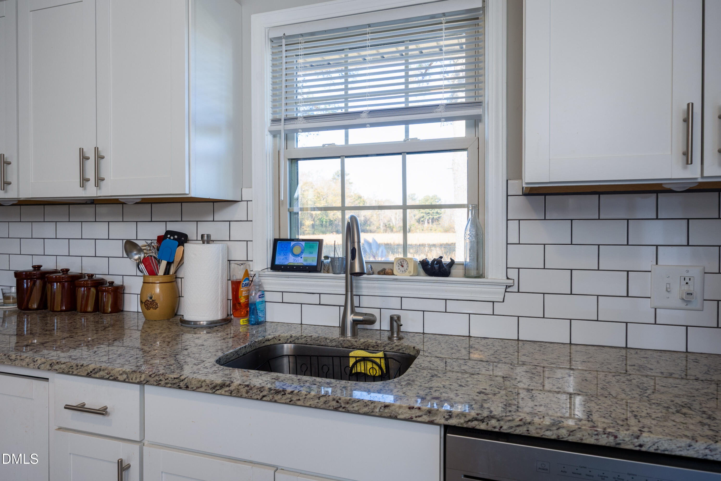 760 Eugene Jernigan Road Dunn, NC 28334 - Photo 10 of 30 a kitchen with a sink a counter and cabinets