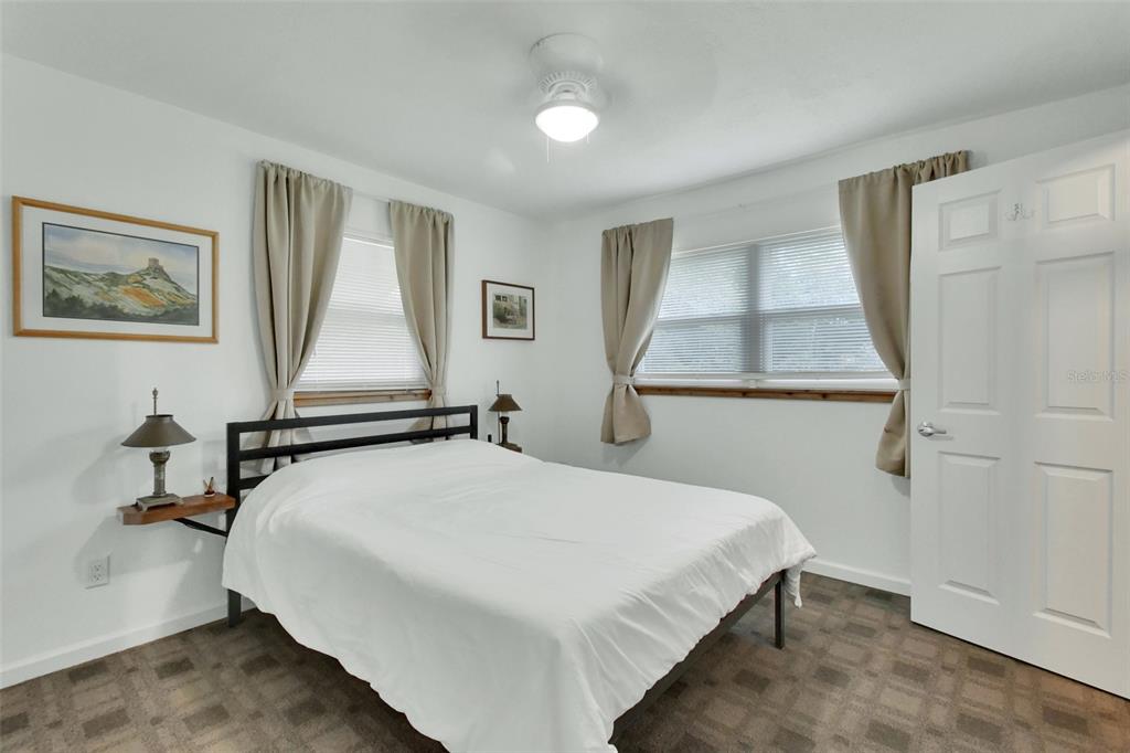 22040 Blue Creek Lodge Road Astor, FL 32102 - Photo 18 of 42 a bedroom with a bed and a window