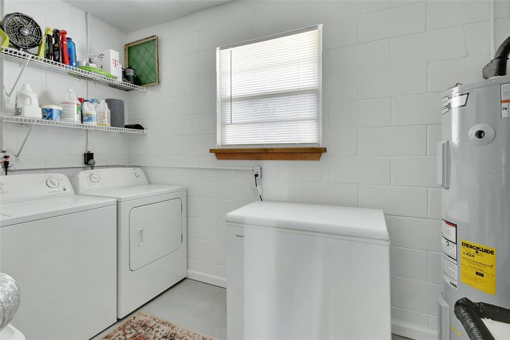22040 Blue Creek Lodge Road Astor, FL 32102 - Photo 26 of 42 a utility room with dryer and washer