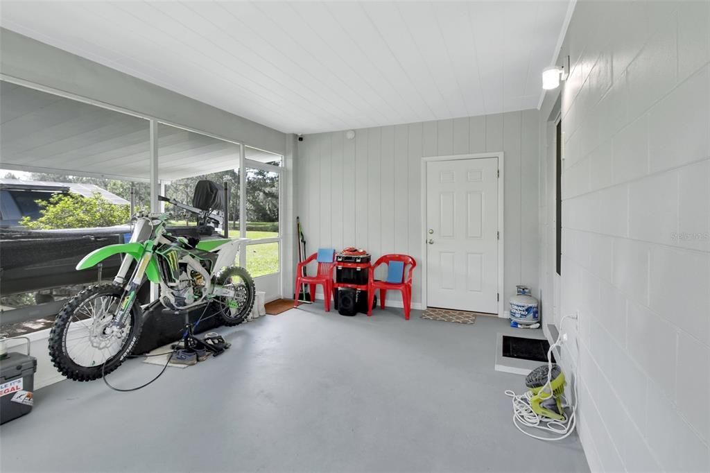 22040 Blue Creek Lodge Road Astor, FL 32102 - Photo 27 of 42 a view of a room with gym equipment