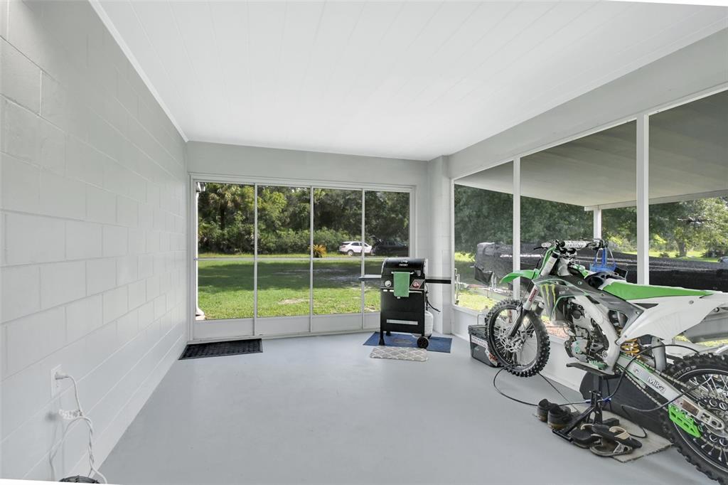 22040 Blue Creek Lodge Road Astor, FL 32102 - Photo 28 of 42 a view of a room with gym equipment