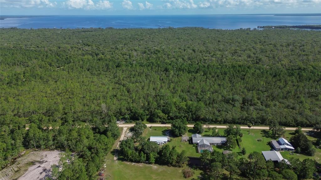 22040 Blue Creek Lodge Road Astor, FL 32102 - Photo 37 of 42 an aerial view of residential house with outdoor space