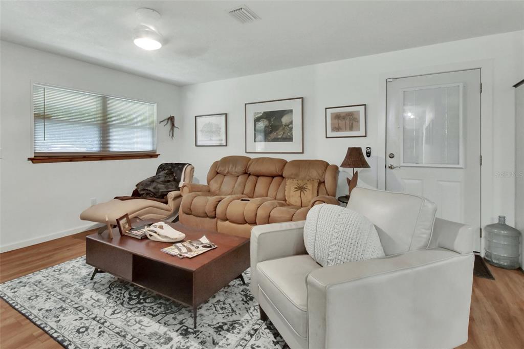 22040 Blue Creek Lodge Road Astor, FL 32102 - Photo 9 of 42 a living room with furniture