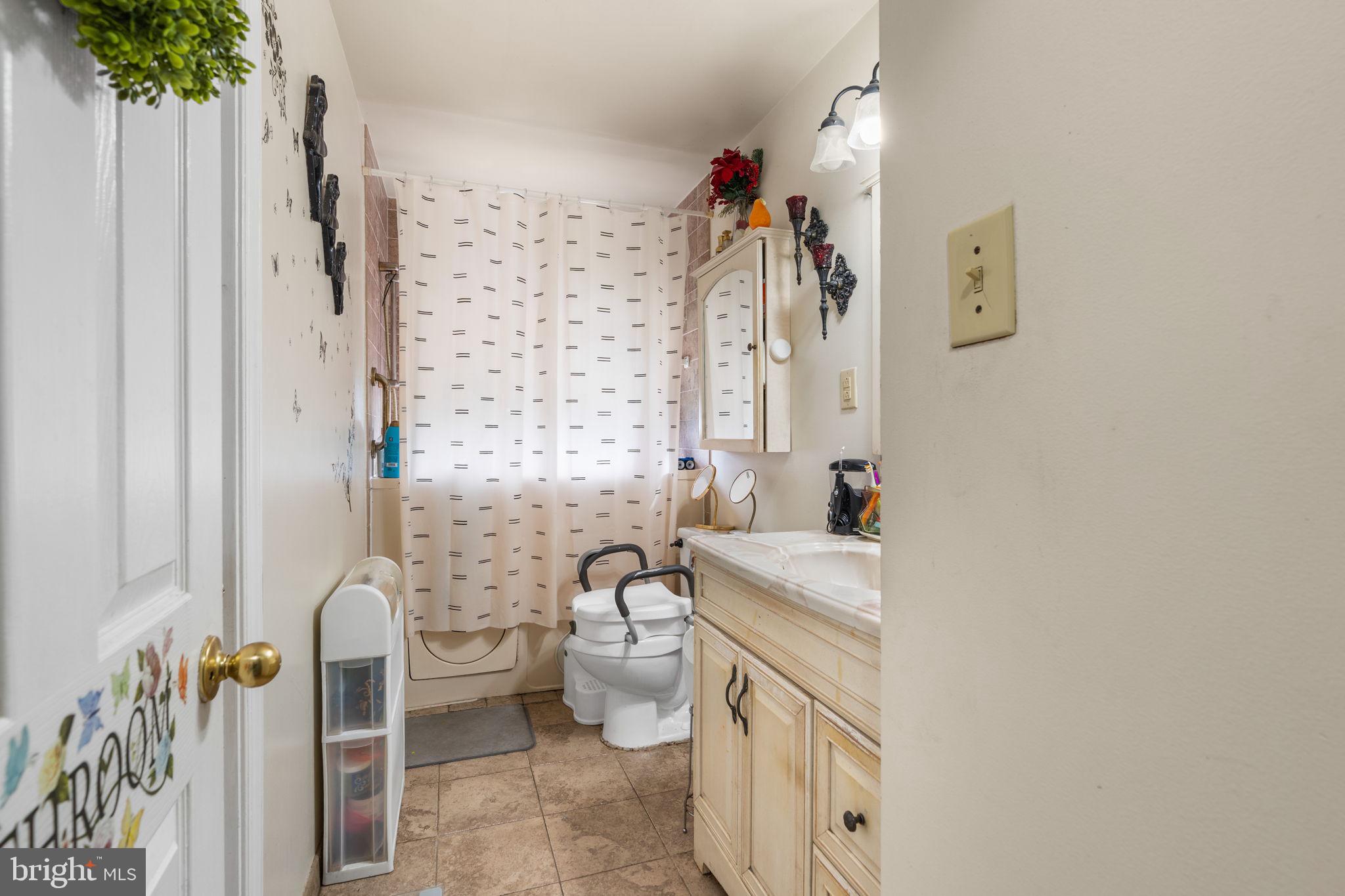 6816 Pepper Street Capitol Heights, MD 20743 - Photo 9 of 12 Charming bathroom with natural light.
