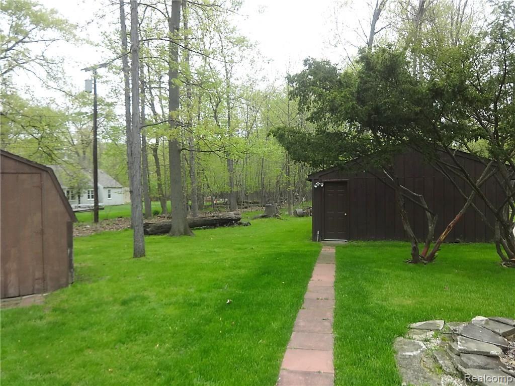 8680 Ferry Road Grosse Ile, MI 48138 - Photo 8 of 28 back yard w garage shed.jpg