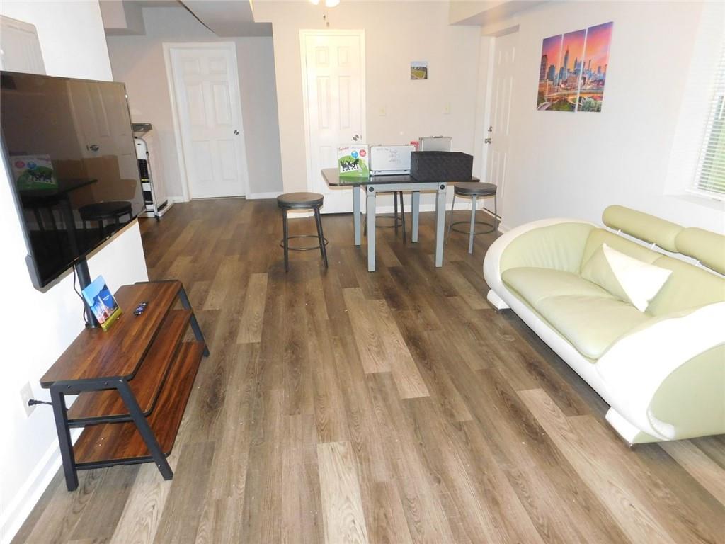 507 Pineridge Road Forest Park, GA 30297 - Photo 7 of 14 a living room with furniture and a wooden floor