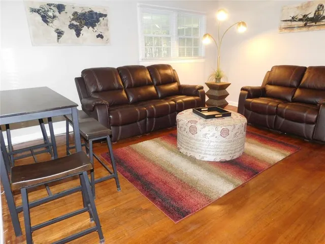 a living room with furniture and a table