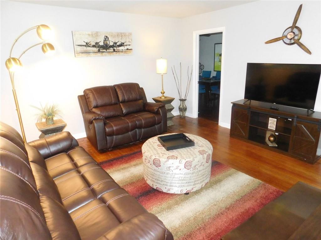 507 Pineridge Road Forest Park, GA 30297 - Photo 10 of 14 a living room with furniture and a flat screen tv