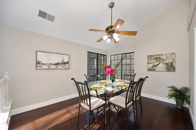a kitchen with stainless steel appliances granite countertop a stove and cabinets