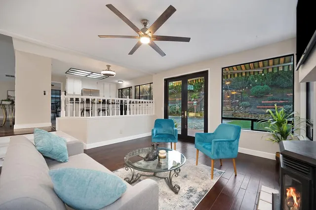 a view of a house with backyard and sitting area