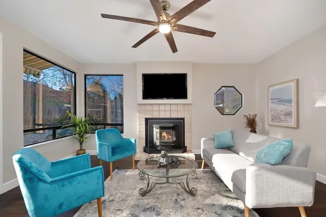 a view of an house with backyard space and a front view of a house