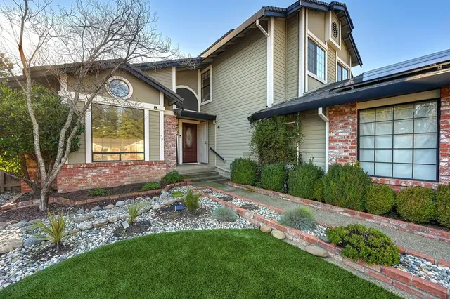 a front view of a house with a yard