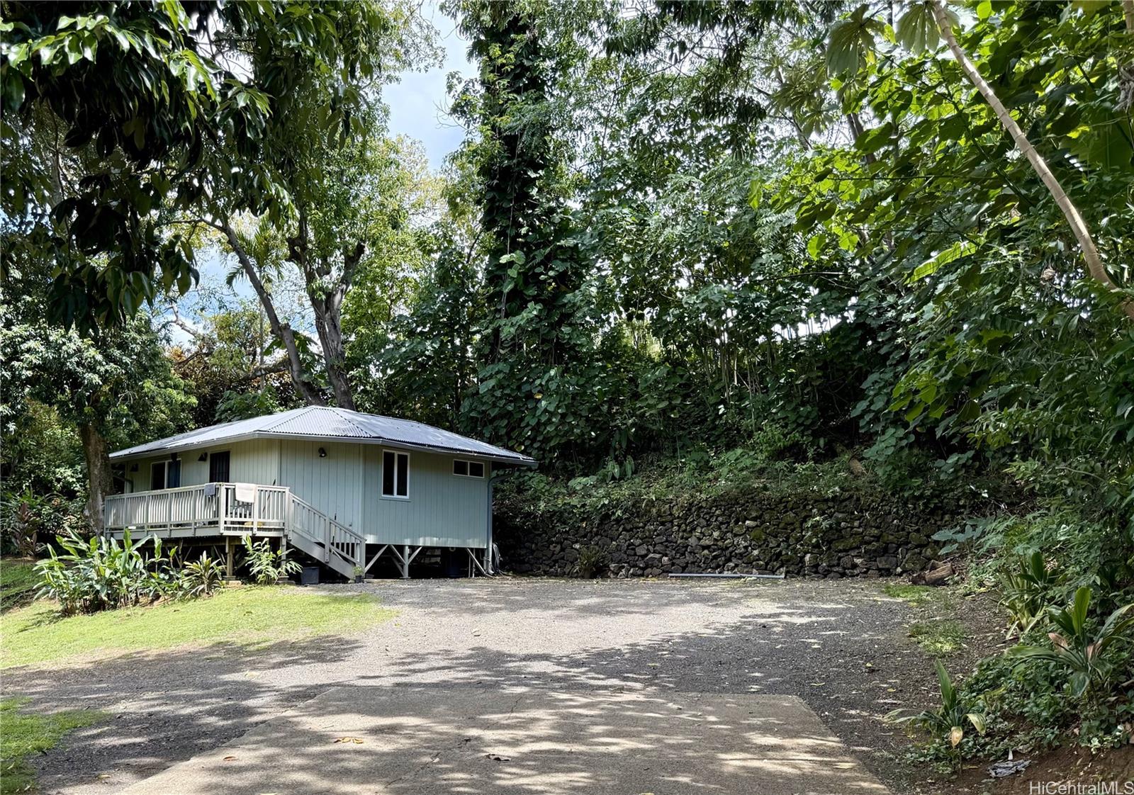 47-351 Waihee Road Kaneohe, HI 96744 - Photo 4 of 7 a front view of a house with a yard and garage
