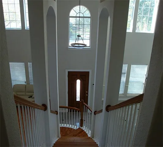 a view of an entryway door with wooden floor