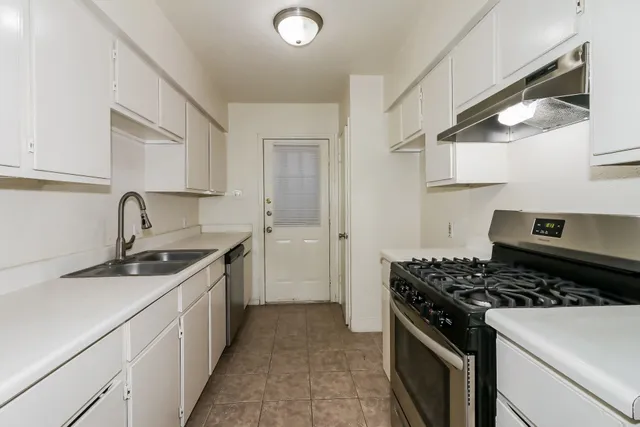 a kitchen with a stove and a sink