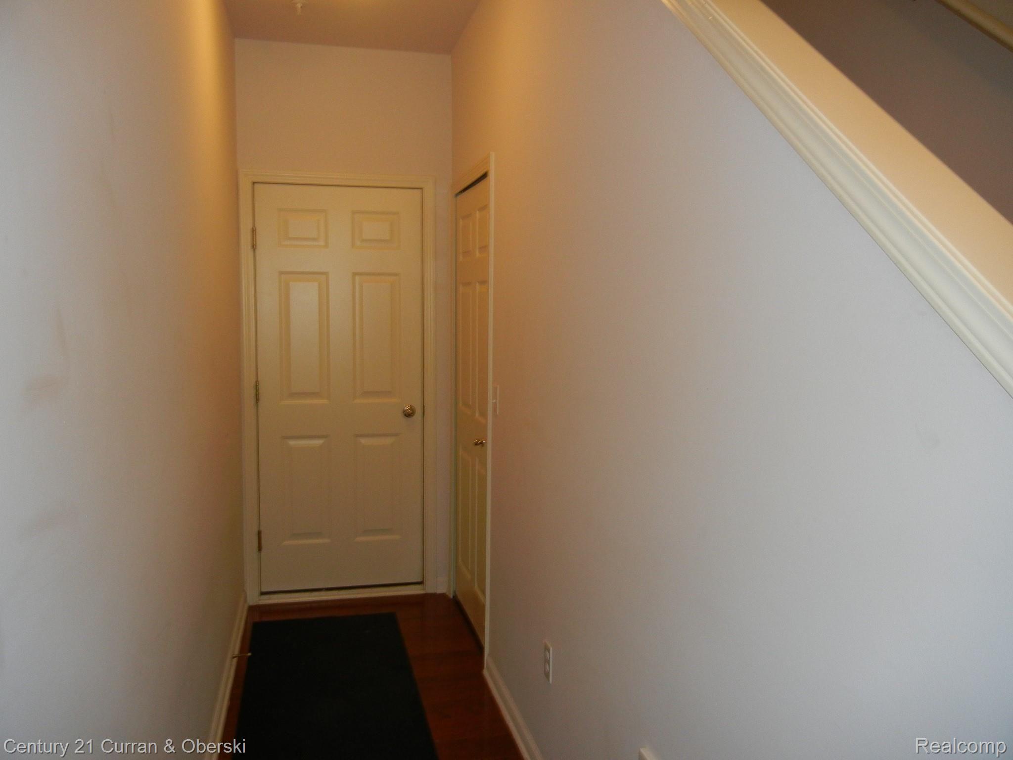 270 North Wixom Road, Unit 60 Wixom, MI 48393 - Photo 23 of 26 Walkway to Garage from Ground Level