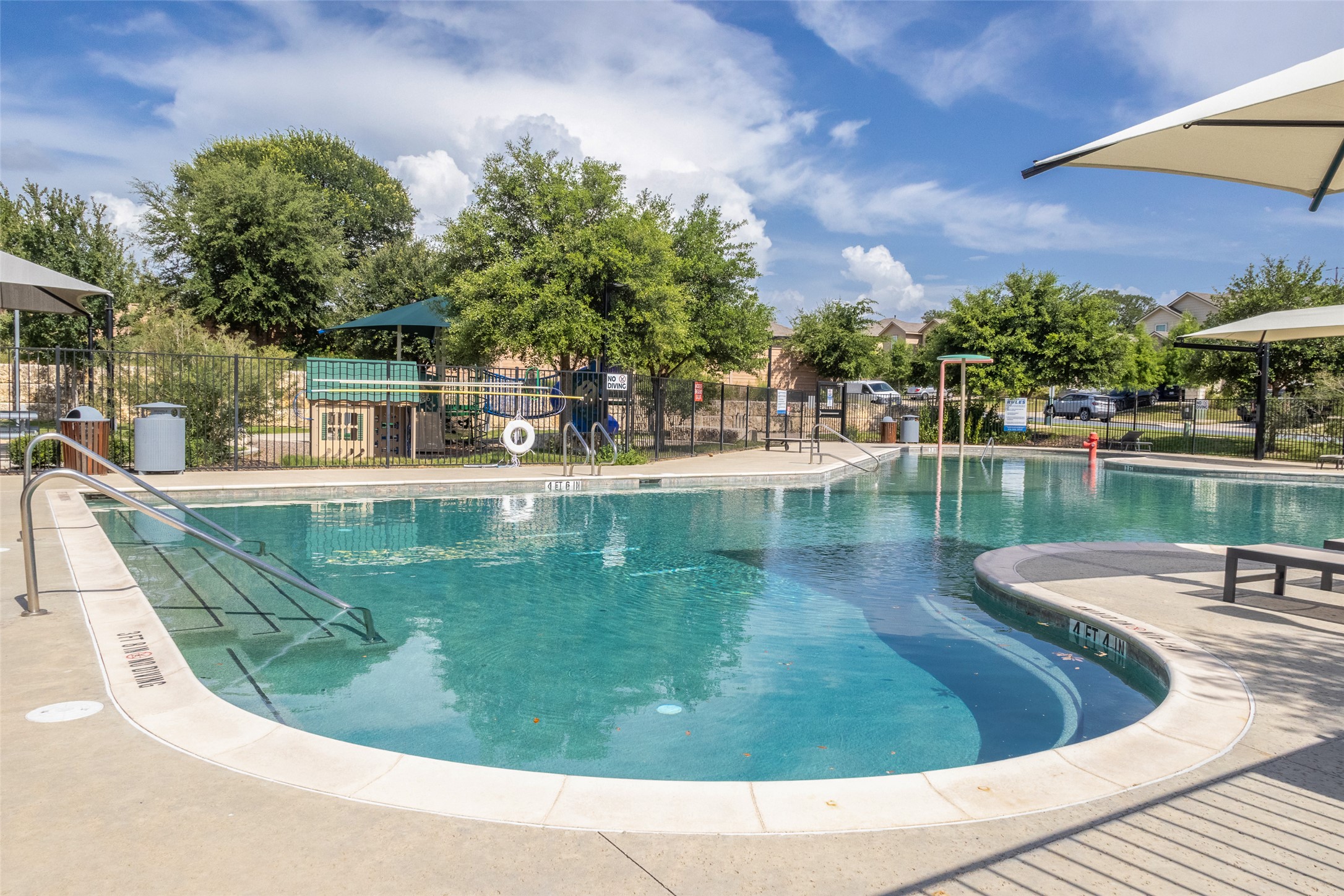 7225 Ranchito Drive Austin, TX 78744 - Photo 37 of 39 A refreshing pool area with an inviting hot tub provides endless outdoor recreation.