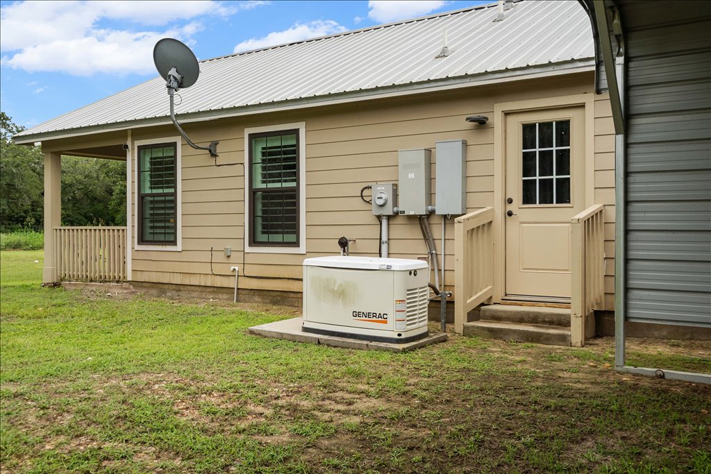 608 Whistleville Road Flatonia, TX 78941 - Photo 14 of 26 You have a full-property Generac backup generator. If the power ever goes out in a storm, you won't even notice—it kicks right on automatically to keep the whole house running.