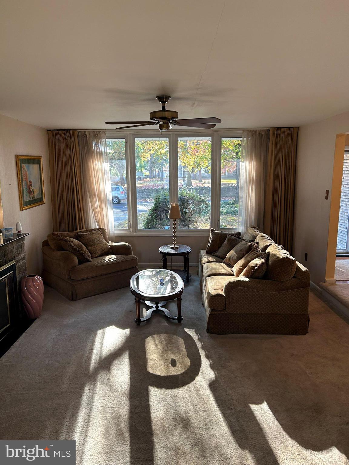 777 West Springfield Road Springfield, PA 19064 - Photo 4 of 17 a living room with furniture and a large window