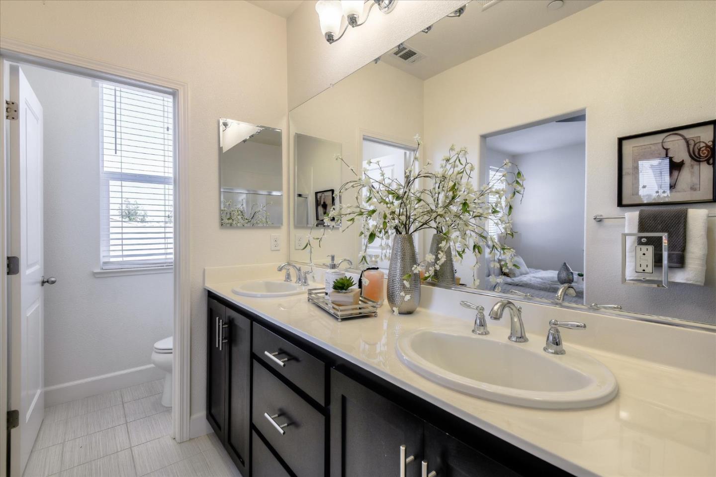 1915 McCandless Drive Milpitas, CA 95035 - Photo 11 of 28 a bathroom with a double vanity sink a and a mirror