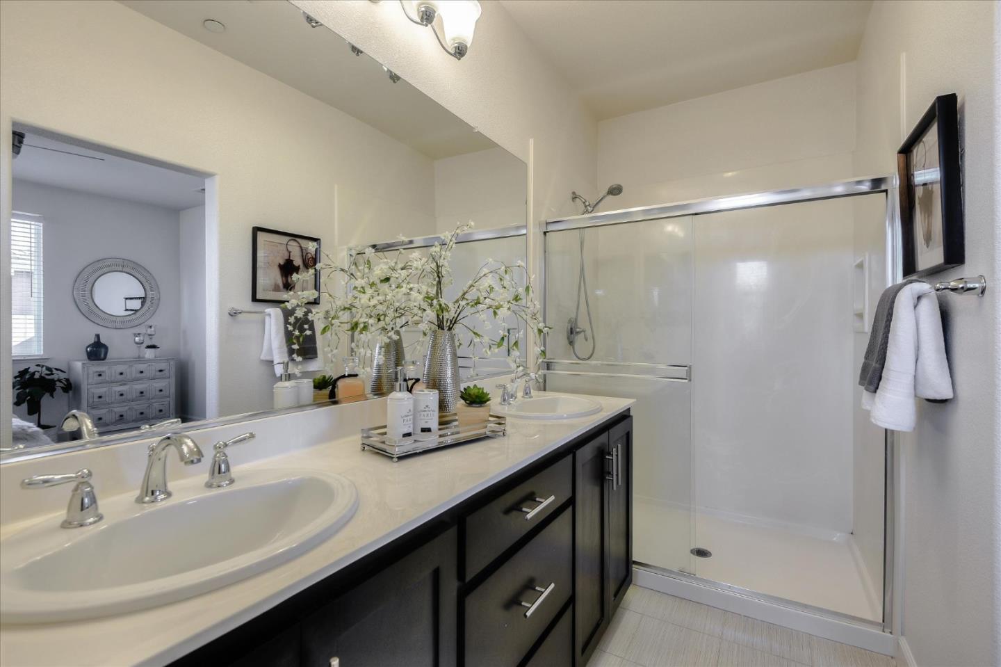 1915 McCandless Drive Milpitas, CA 95035 - Photo 12 of 28 a bathroom with a double vanity sink mirror and shower